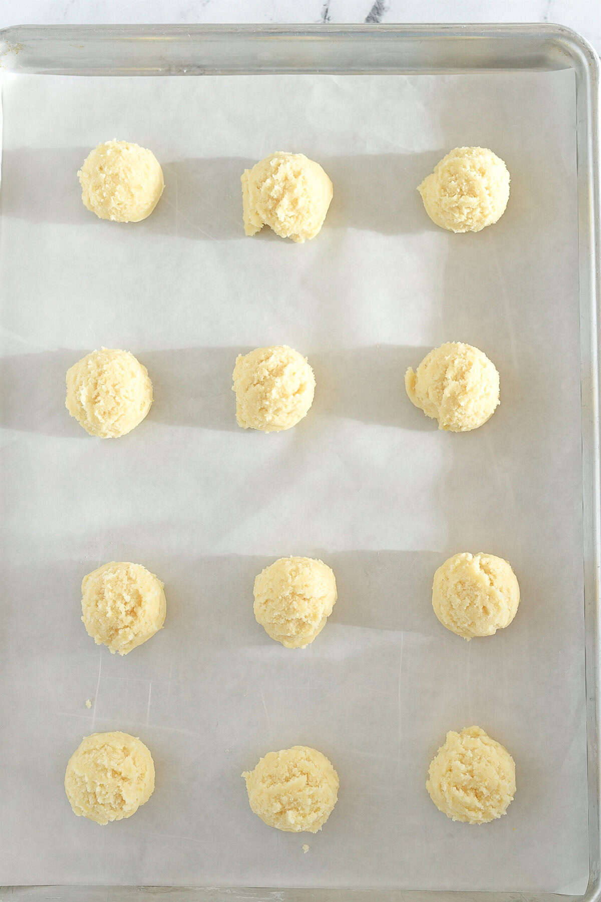 lemon sugar cookie dough on baking sheet