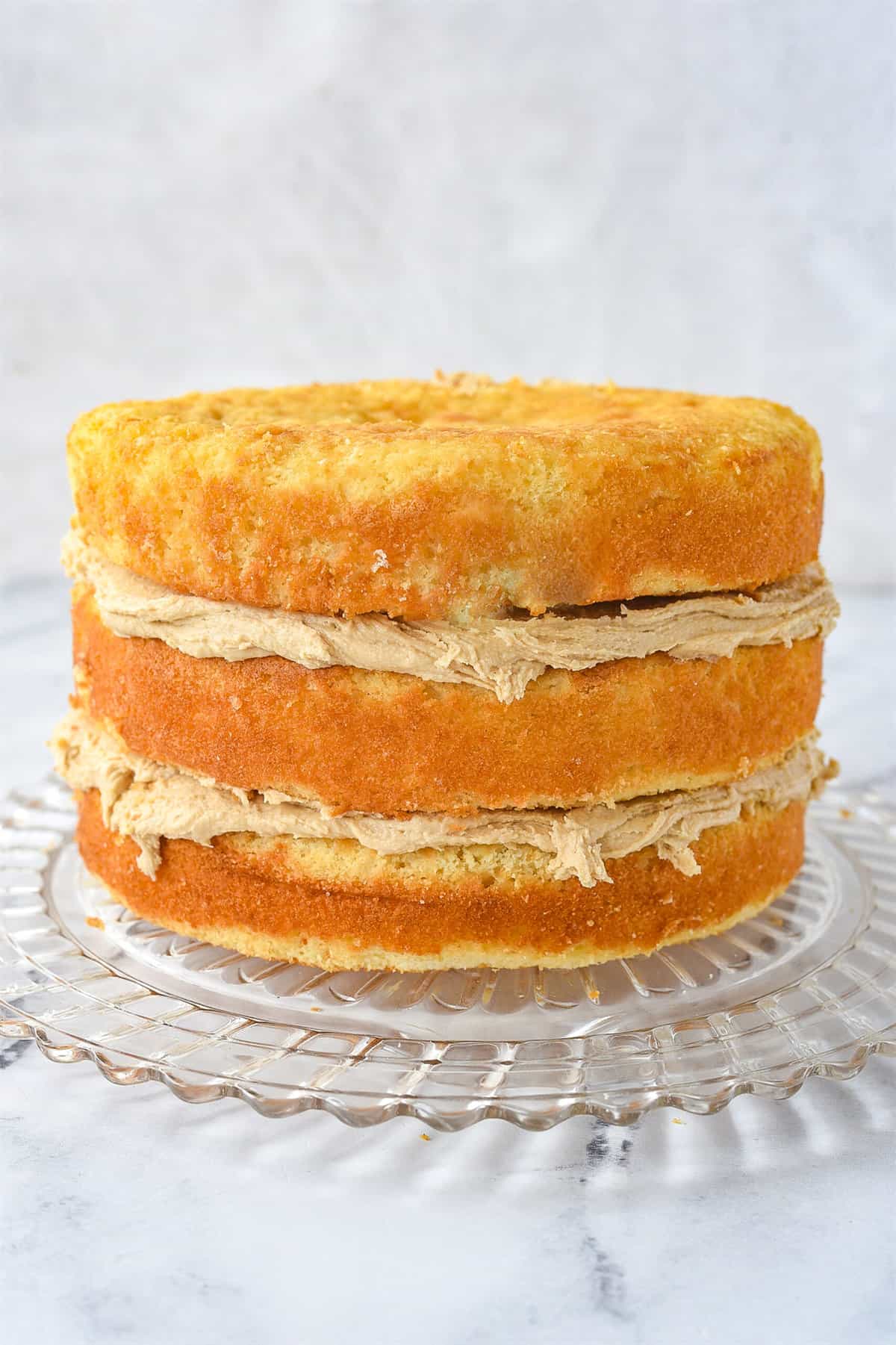 layer of caramel frosting between three layers of cake