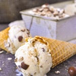 scoop of malted milk ice cream on a cone lying on it's side