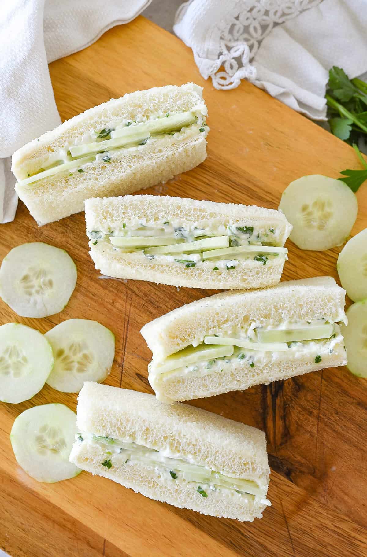cucumber sandwiches on a board