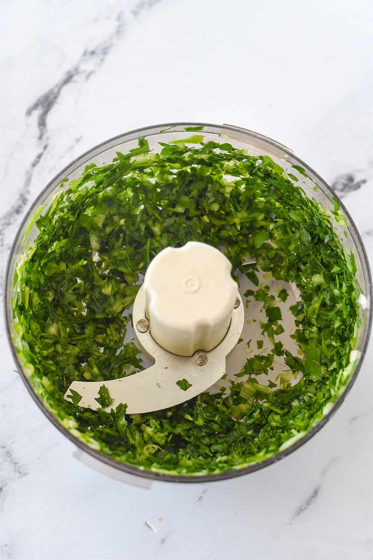 finely chopped green onion and parsley in a food processor