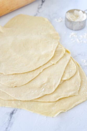 stack of rolled out flour tortillas