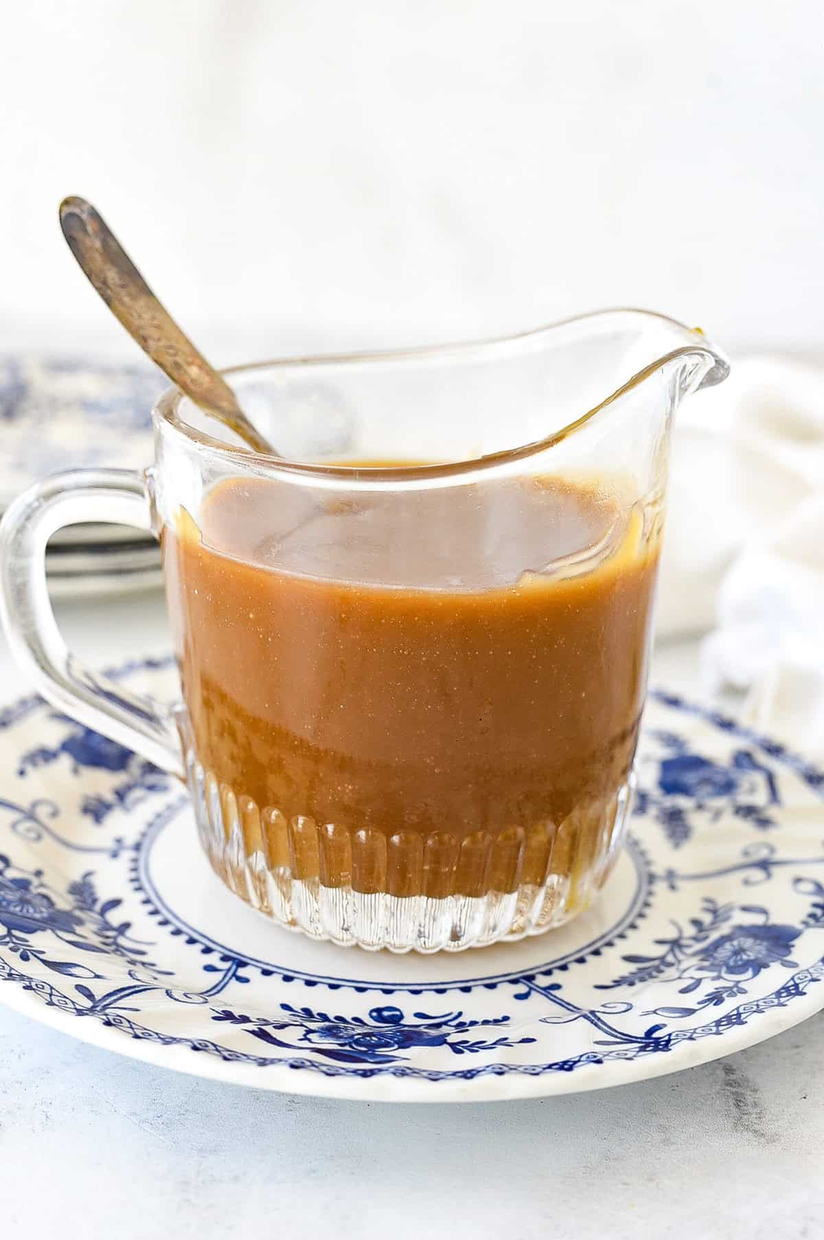 pitcher of caramel sauce on a plate