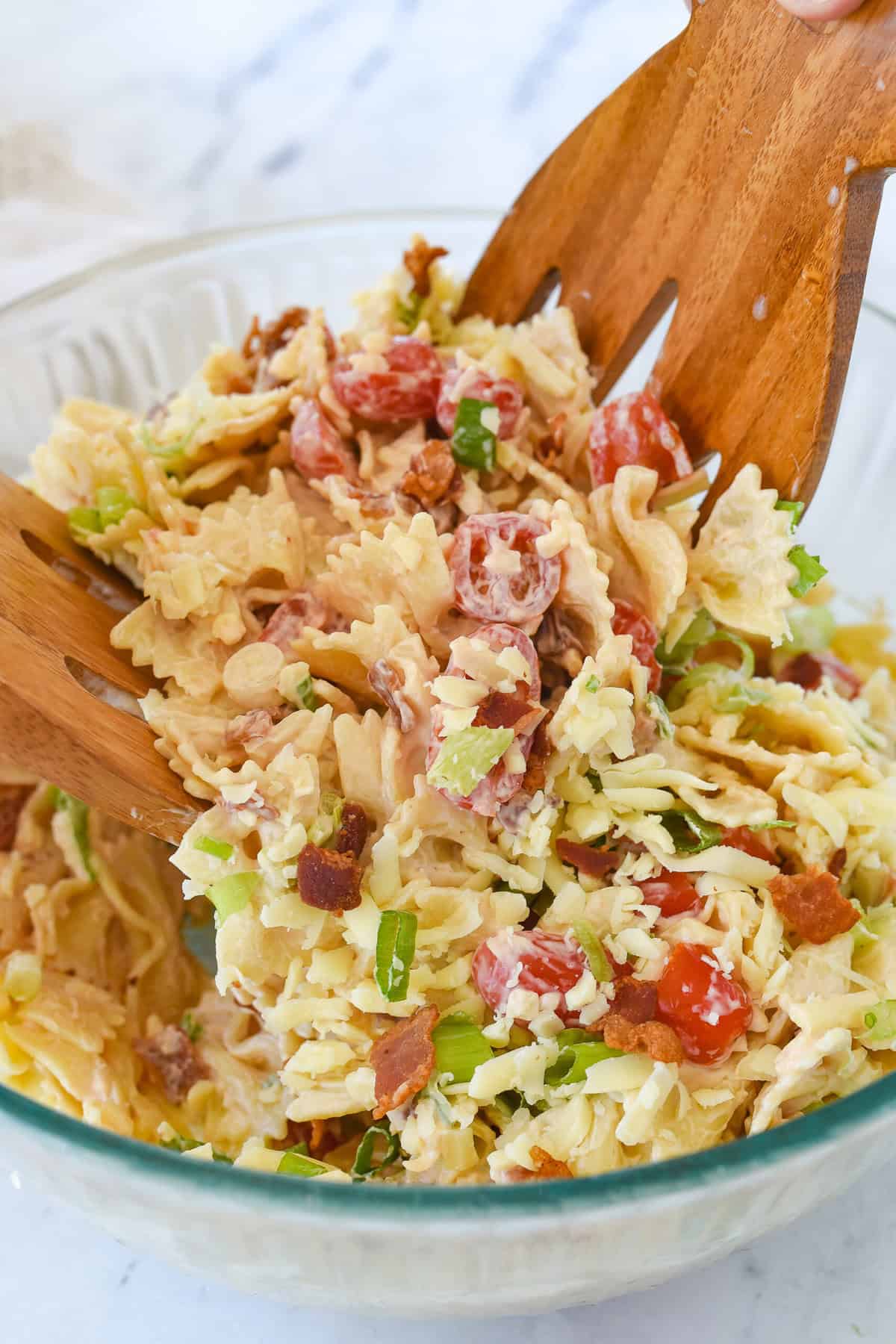 tossing blt  pasta salad
