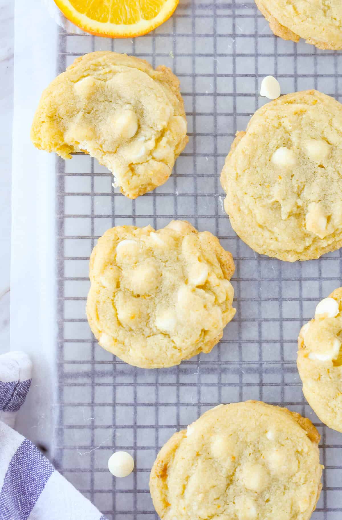 overhead shot of creamsicle cookie with a bite missing