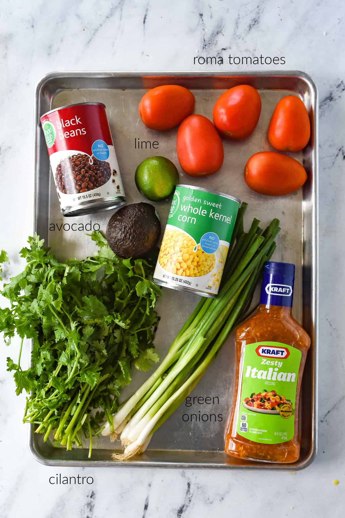 ingredients on a cookie sheet for cowboy caviar
