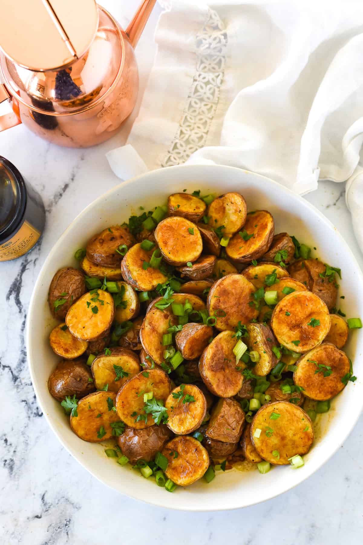 overhead shot of balsamic roasted potatoes in a bowl