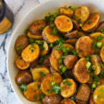 balsamic roasted potatoes in a white bowl