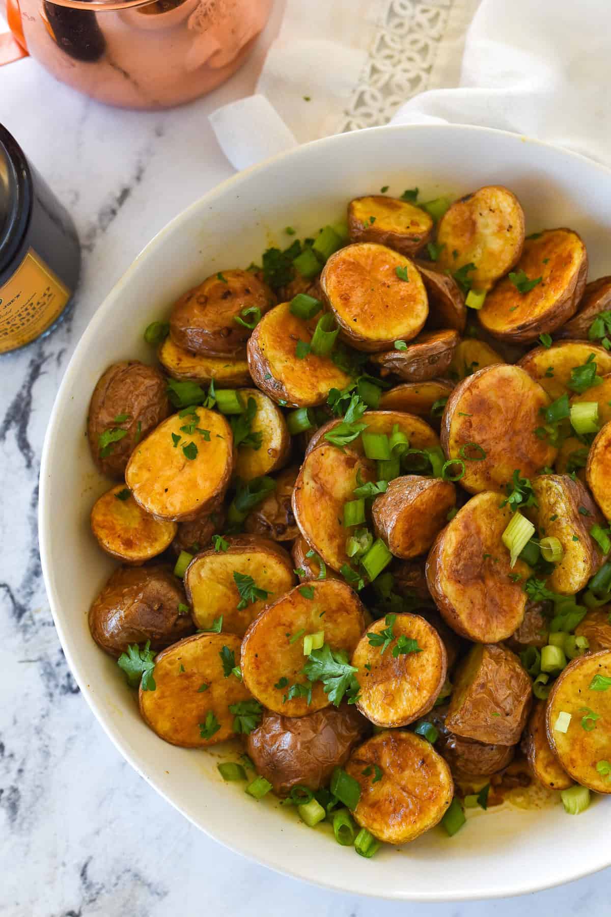 balsamic roasted potatoes in a white bowl
