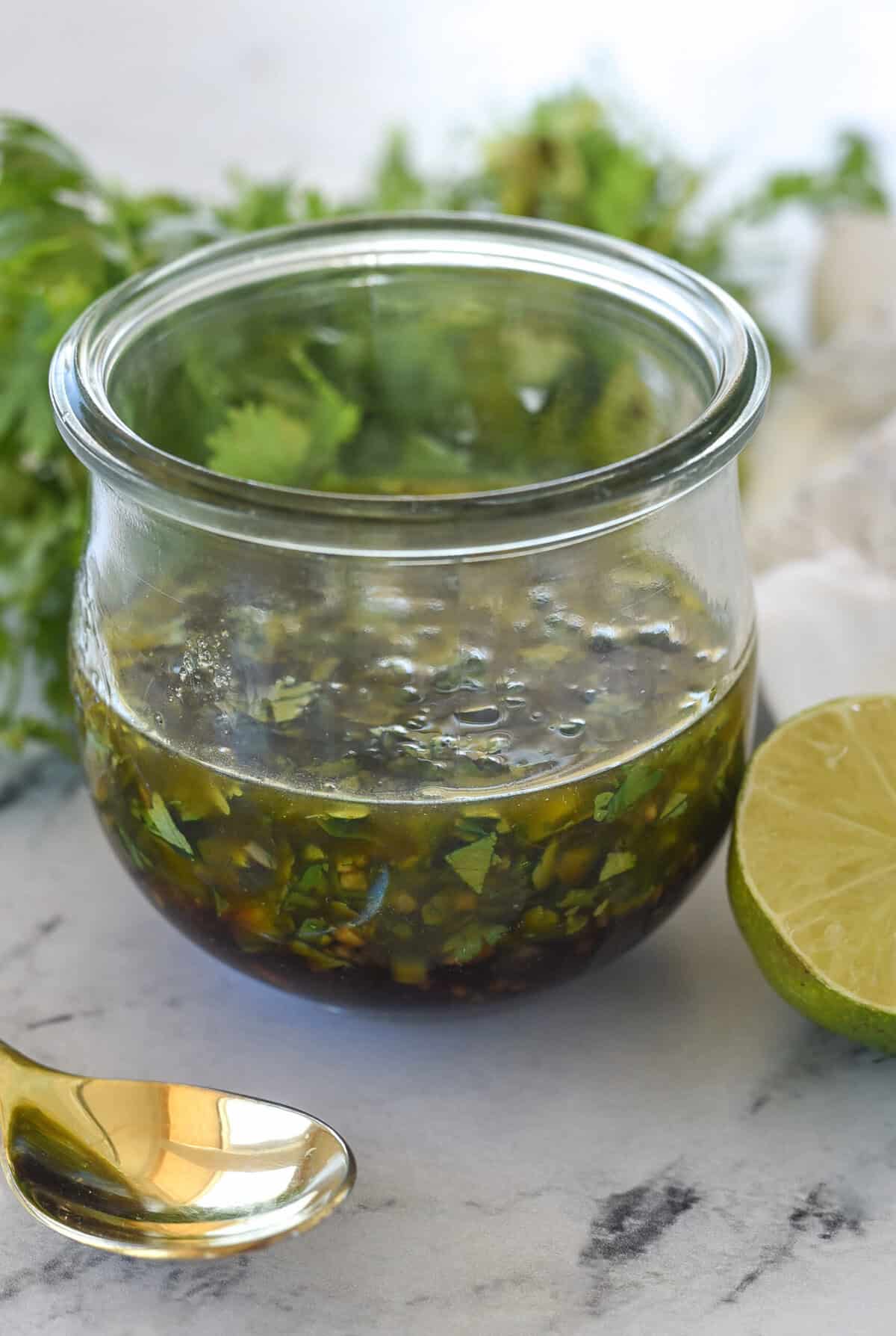 Chimichurri  sauce  in a glass container