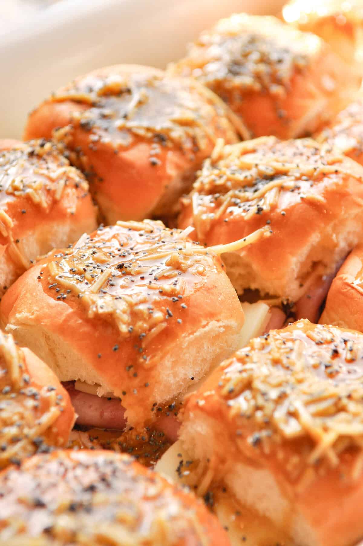 ham and cheese sliders in a pan ready for the oven