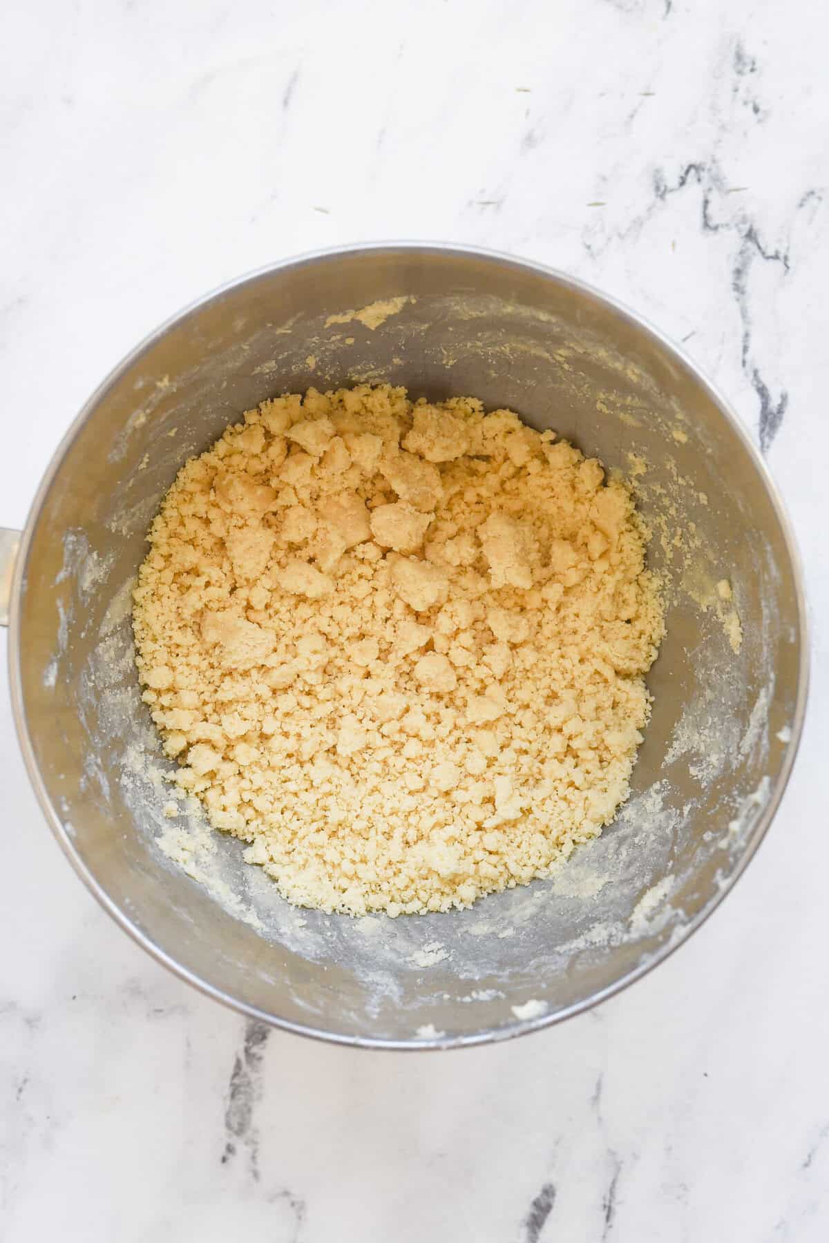 crumbly sugar cookie dough in bowl