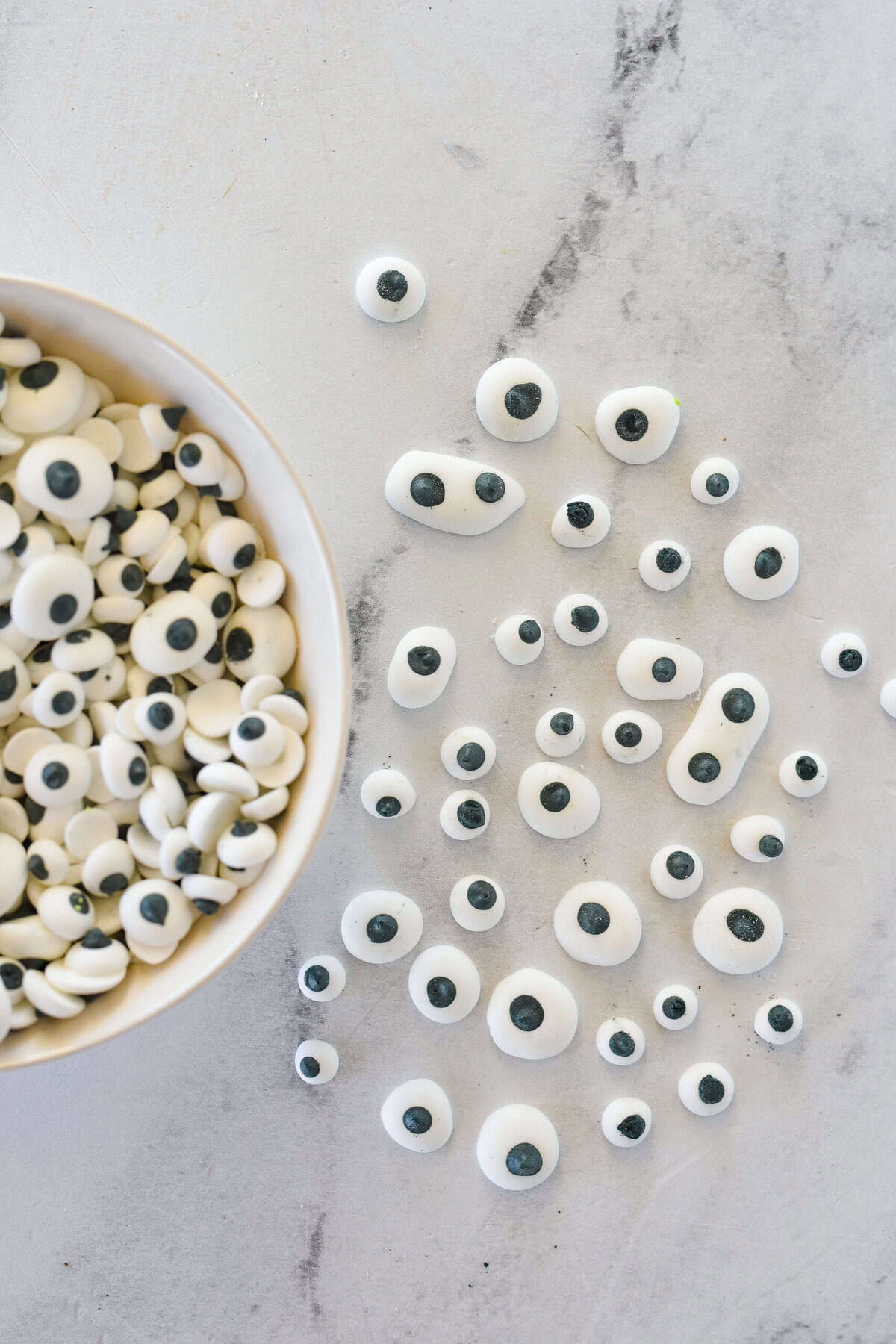 googly candy eyes in a bowl and on the counter