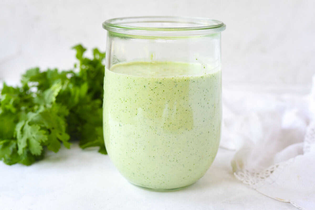 creamy tomatillo dressing in a jar.