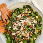 overhead shot of bowl of harvest salad with dressing in a jar