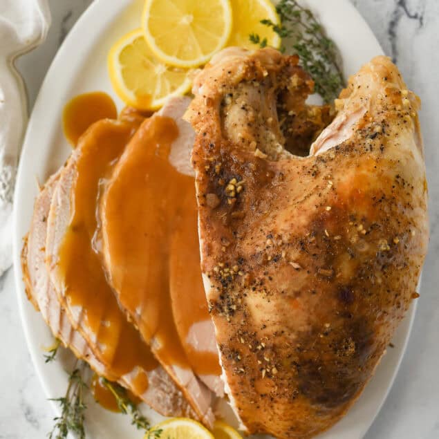 overhead shot of a turkey breast on a platter