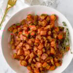 white bowl of roasted sweet potatoes