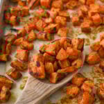 wooden spoon full of roasted sweet potatoes