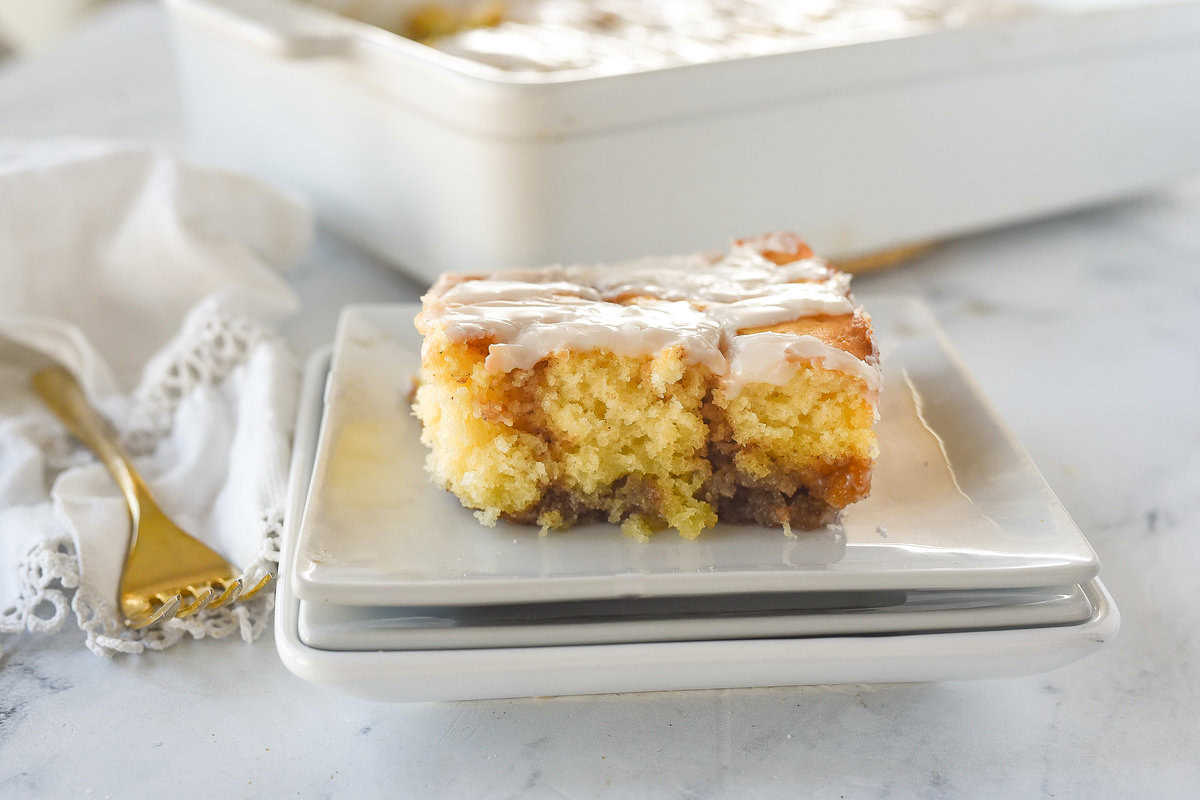 slice of cinnamon roll cake on a white plate