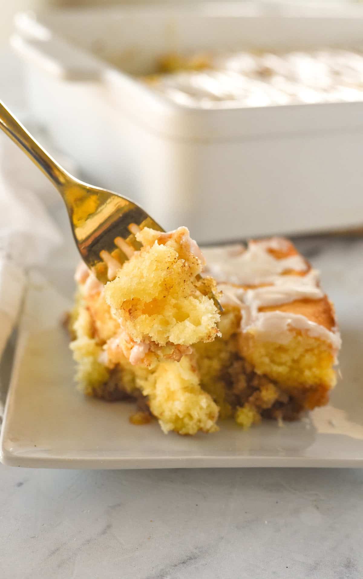 fork full of cinnamon roll cake