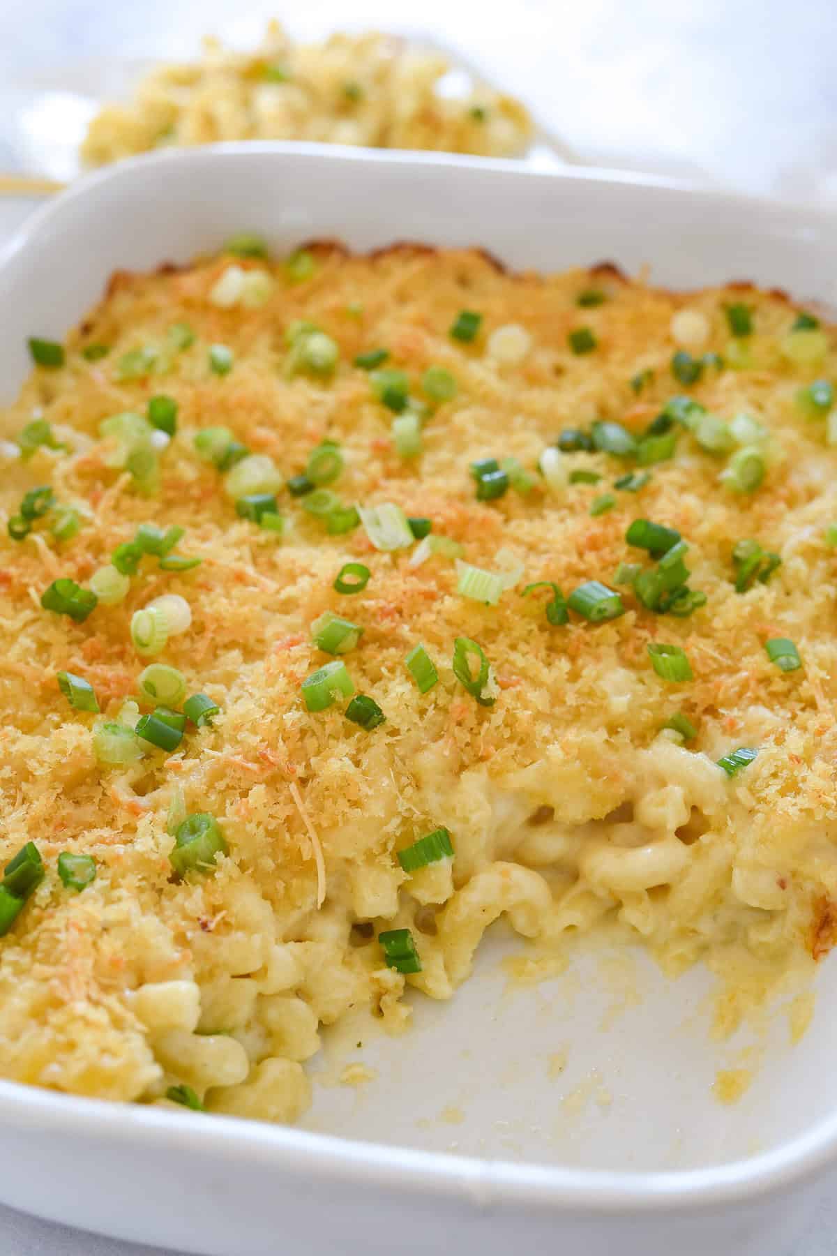 dish full of mac and cheese with some missing
