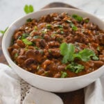 bowl of black beans on a cutting board