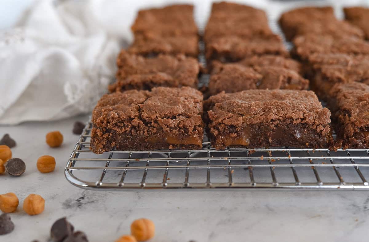 side view of caramel brownies on cooling rack
