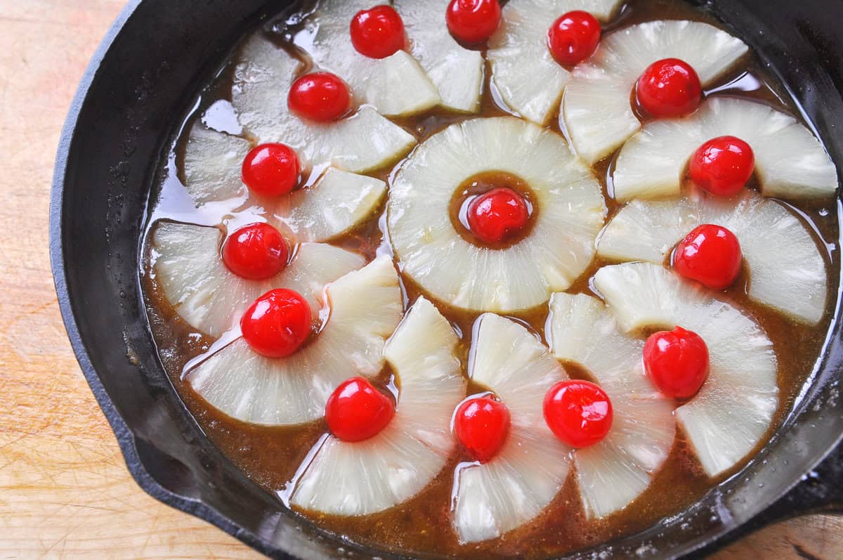 pineapple and cherries iin a cast iron pan