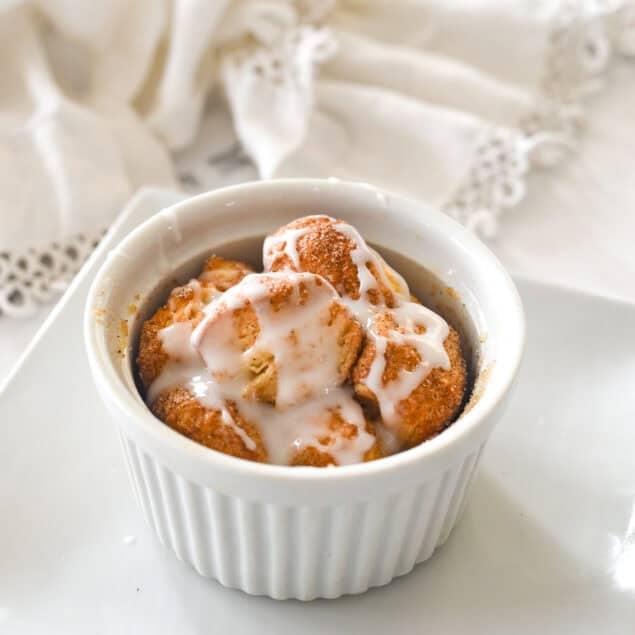 an individual monkey bread for one with glaze on top.
