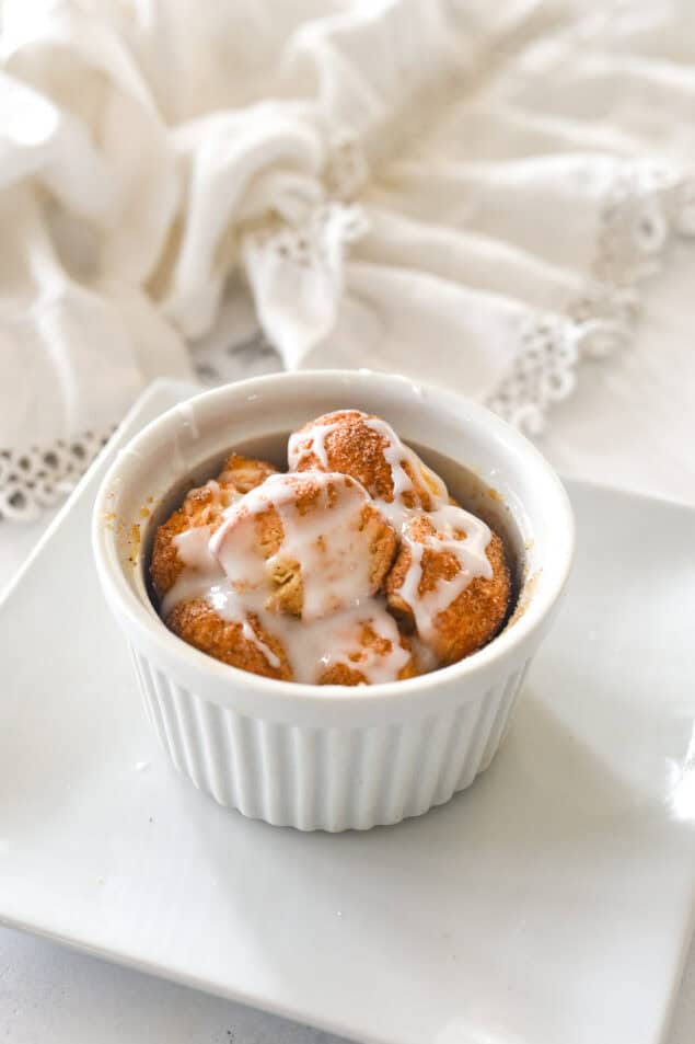 an individual monkey bread for one with glaze on top.