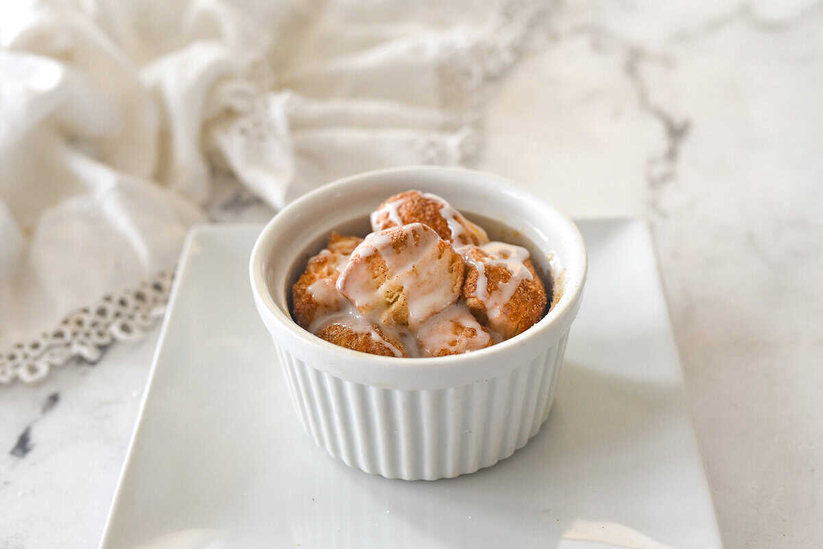 a white ramekin with monkey bread for one in it