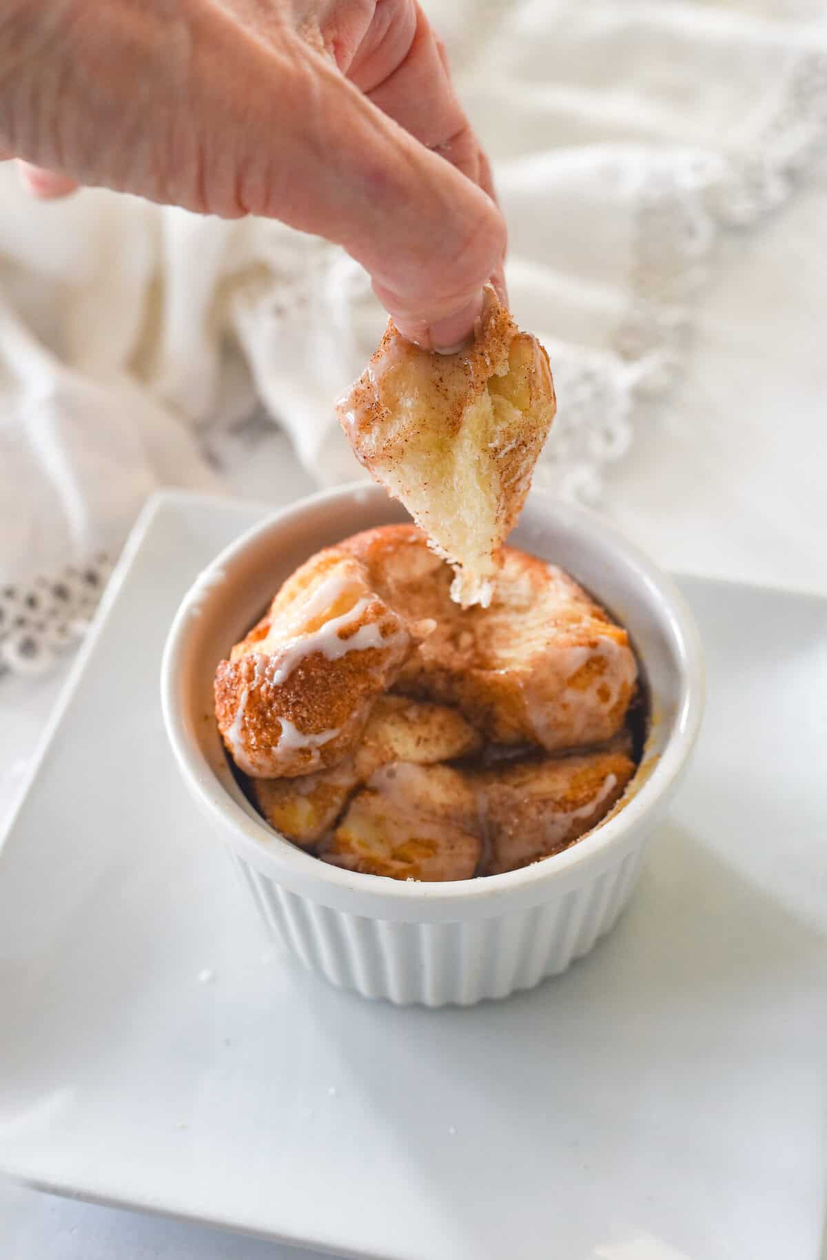 hand pulling out some monkey bread