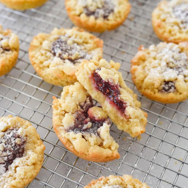 individual jam tarts on a cooling rack