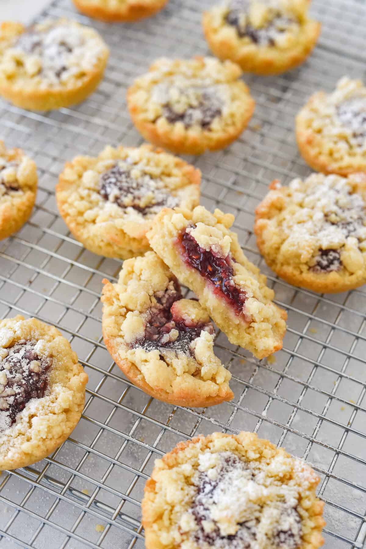 individual jam tarts on a cooling rack