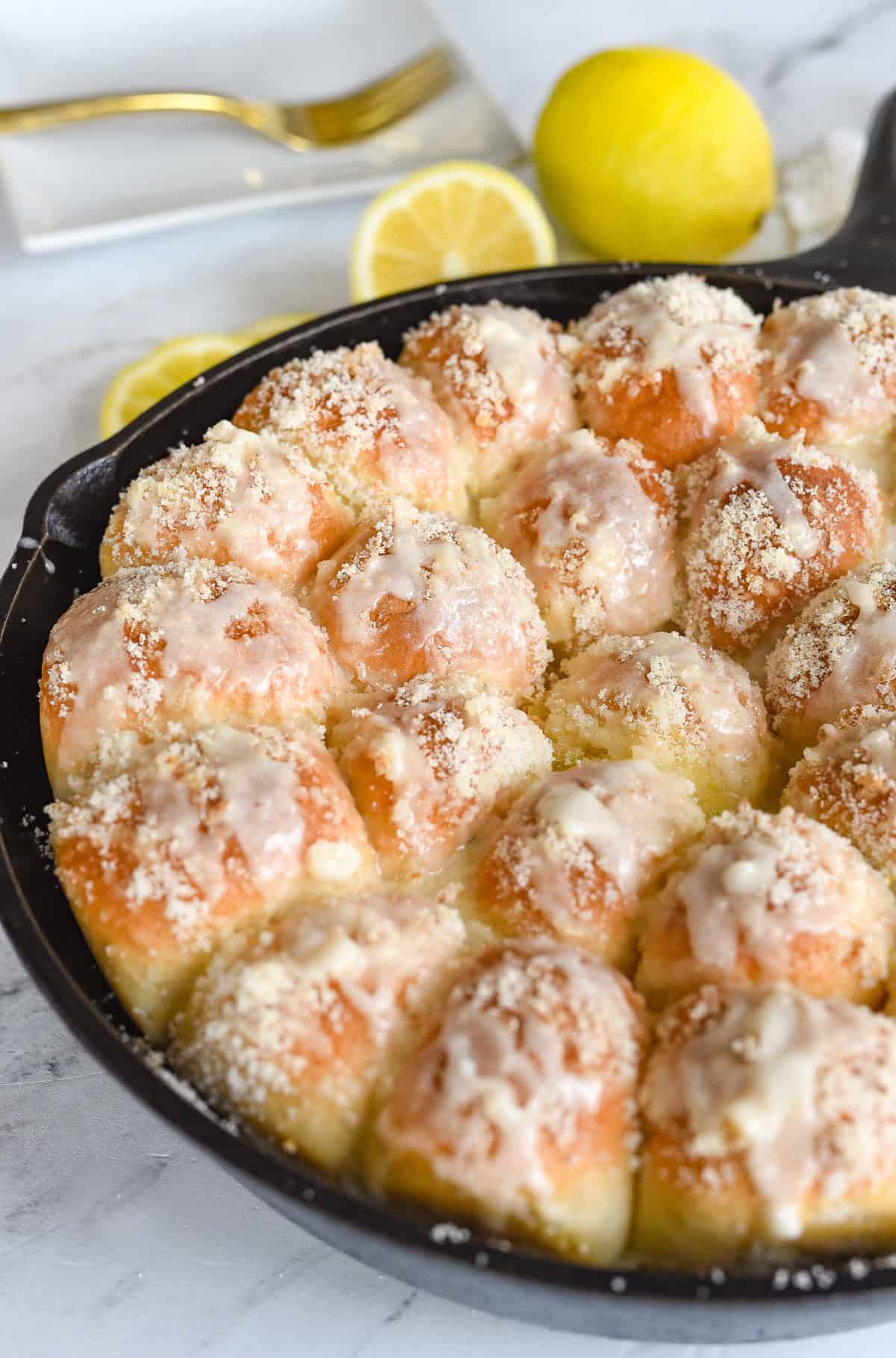 cast iron pan full of lemon pull apart rolls