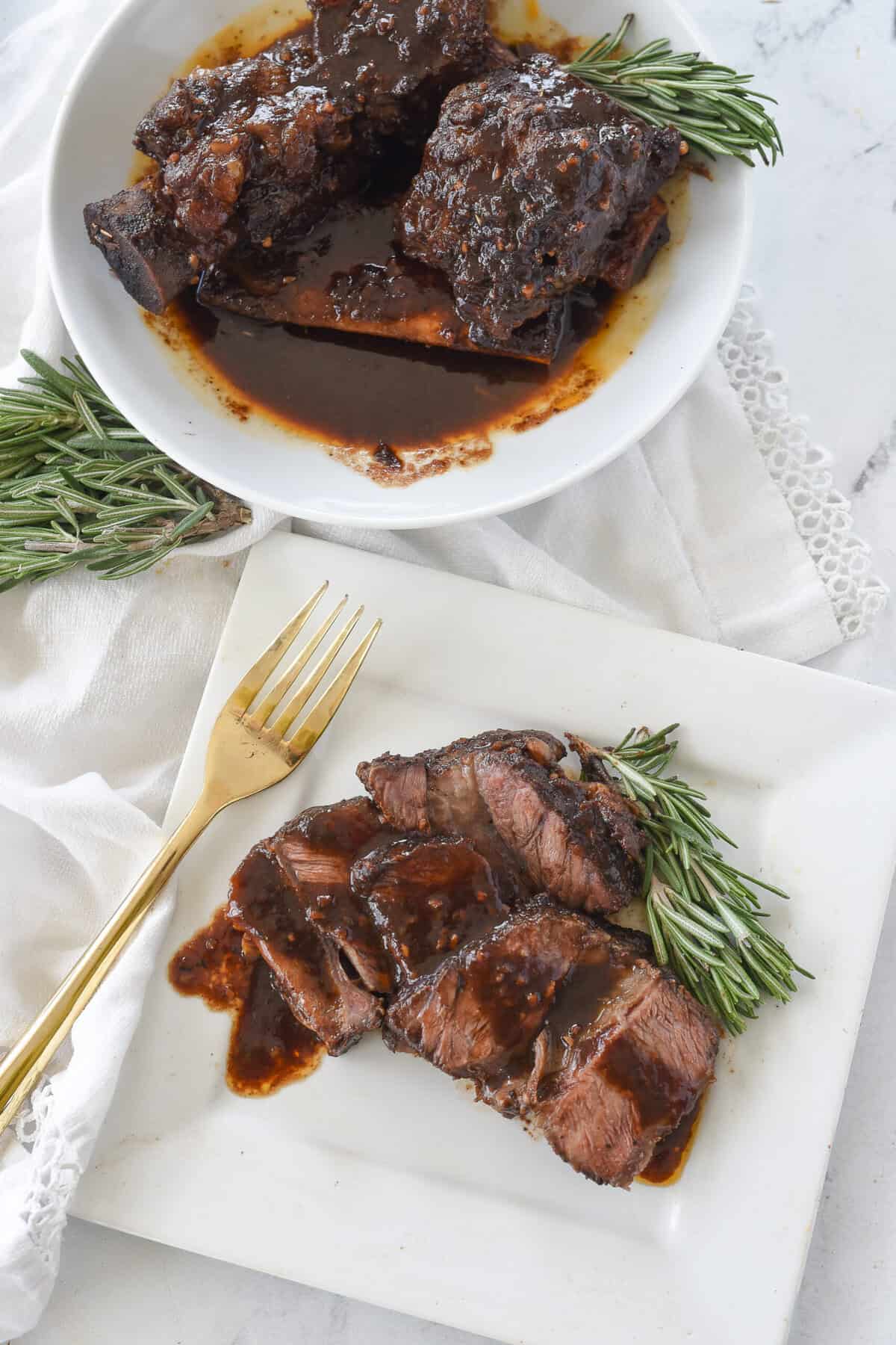 slliced short rib on plate with sauce on top