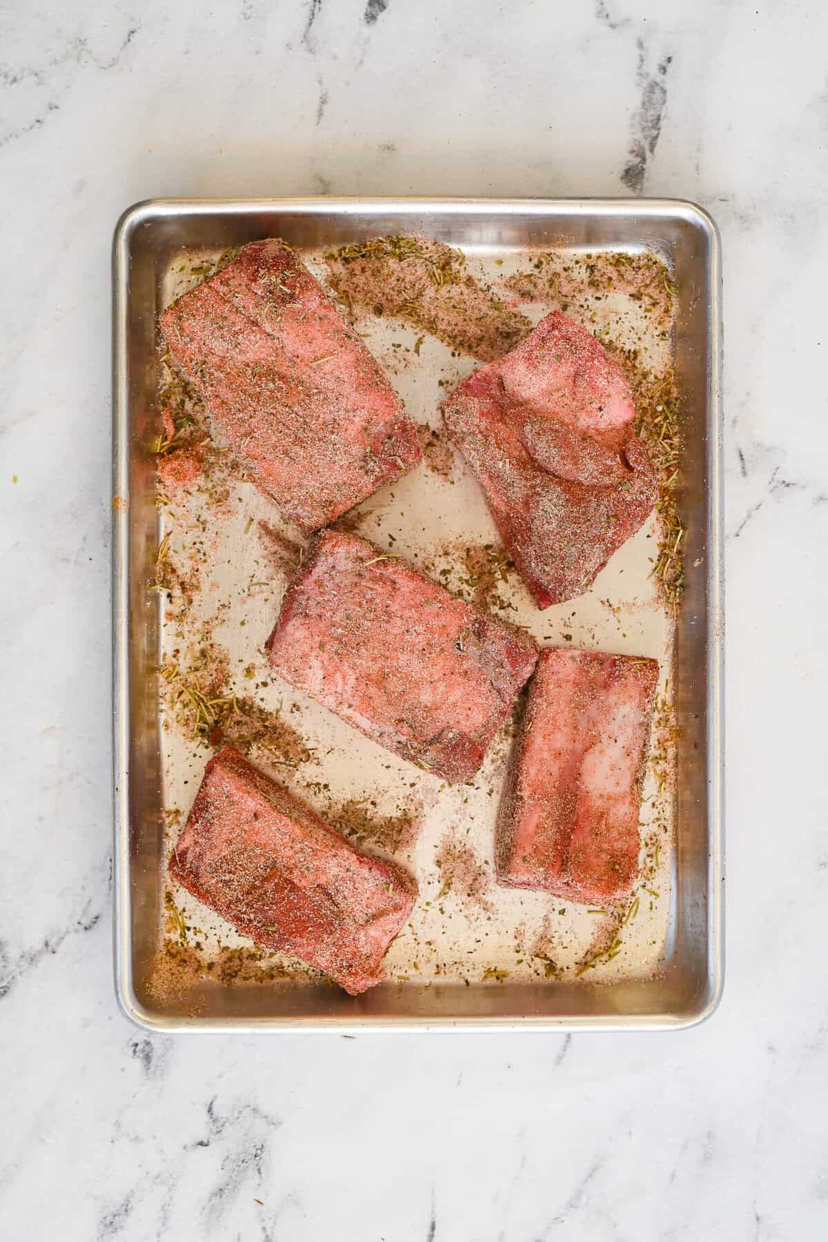 overhead view of shortribs with rub applied