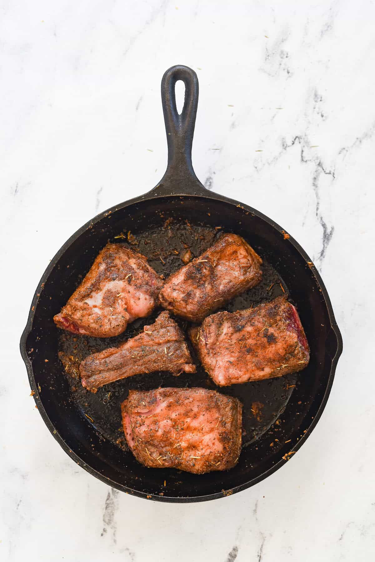 braised short ribs in cast iron pan