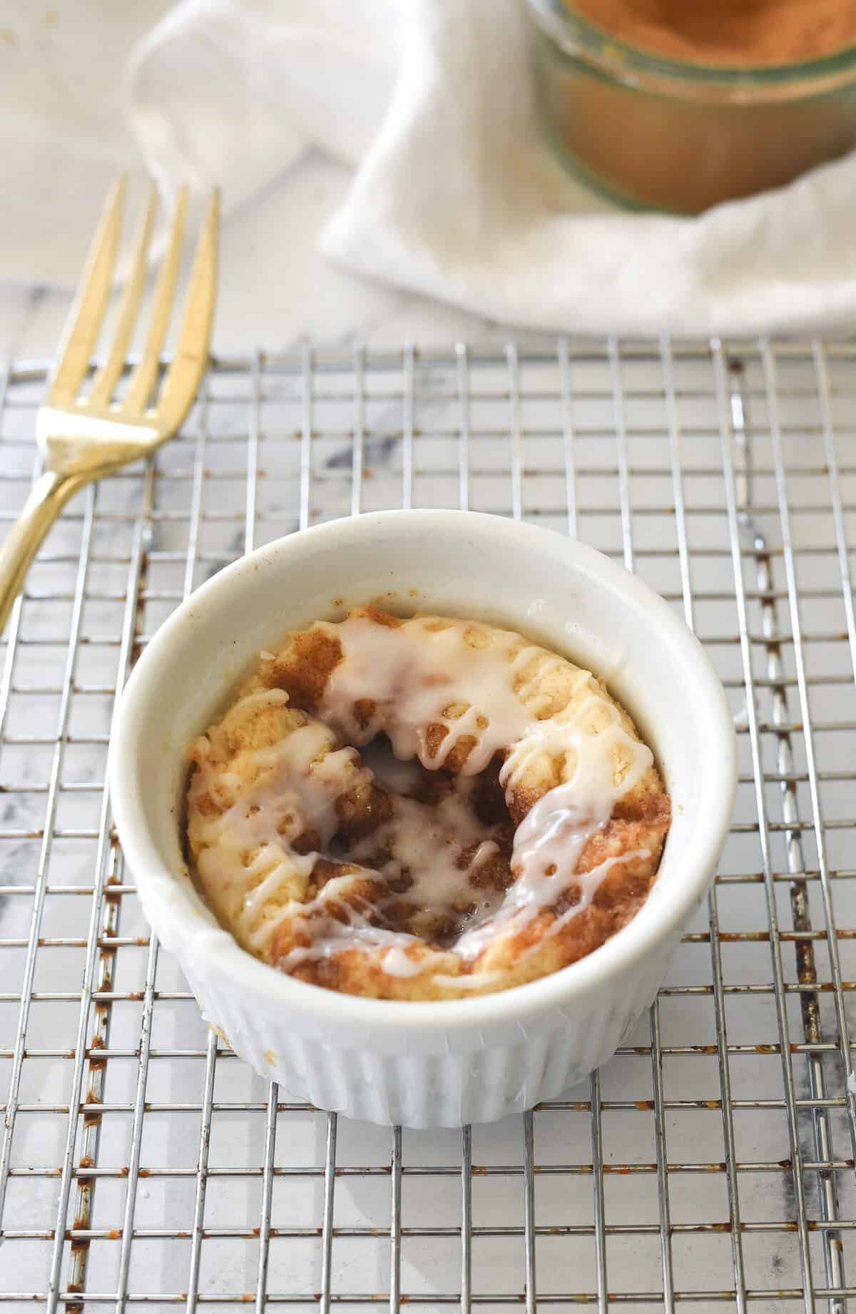 mug coffee cake cooling on a rack