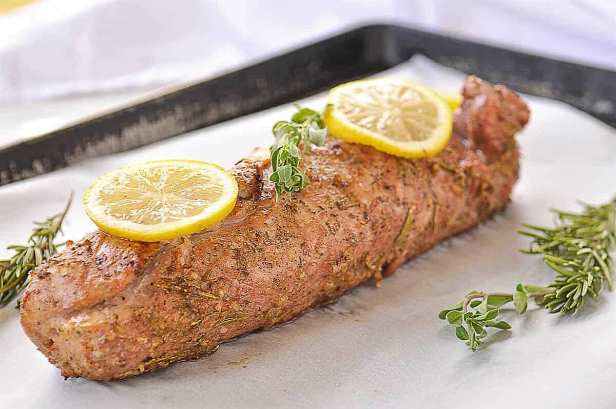 grilled pork tenderloin on a baking sheet