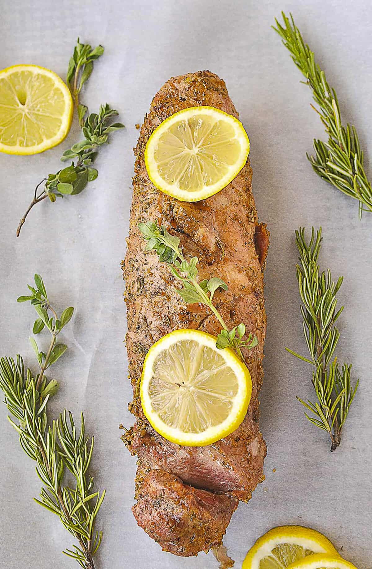 overhead shot of lemon pork tenderloin with slices of lemon on top