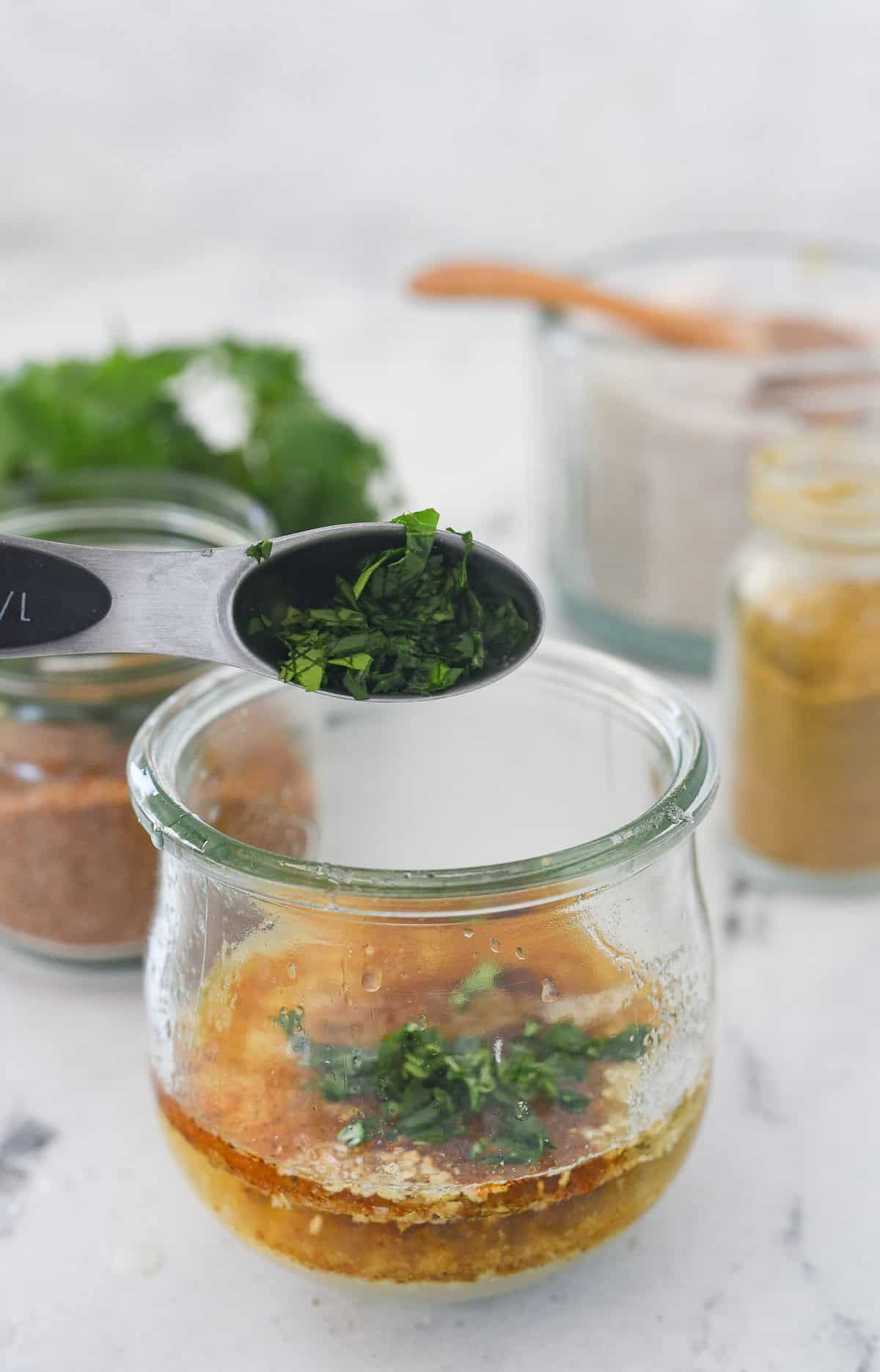 adding chopped fresh cilantro to dressing