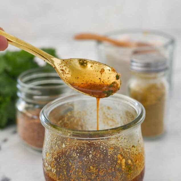 spoonful of taco salad dressing and a jar