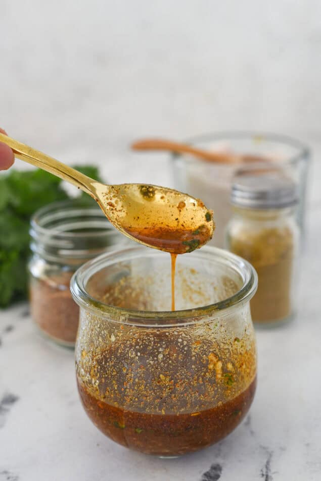 spoonful of taco salad dressing and a jar