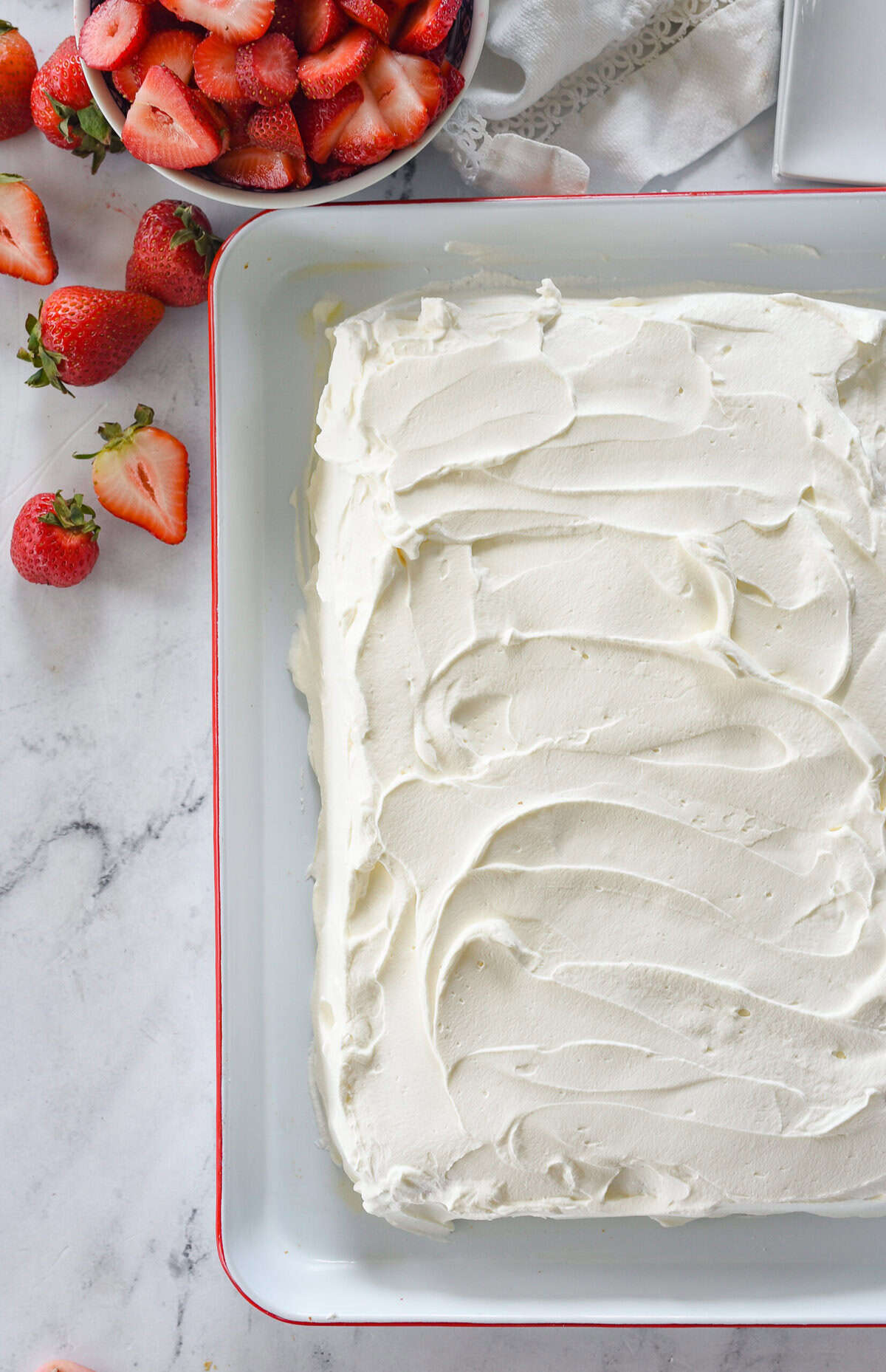 whipped cream frosted tres leches cake