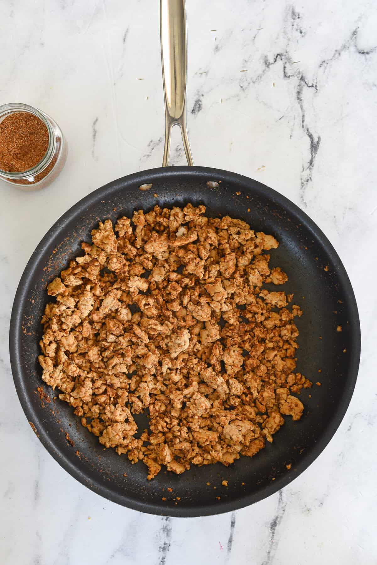 cooked ground chicken in a frying pan
