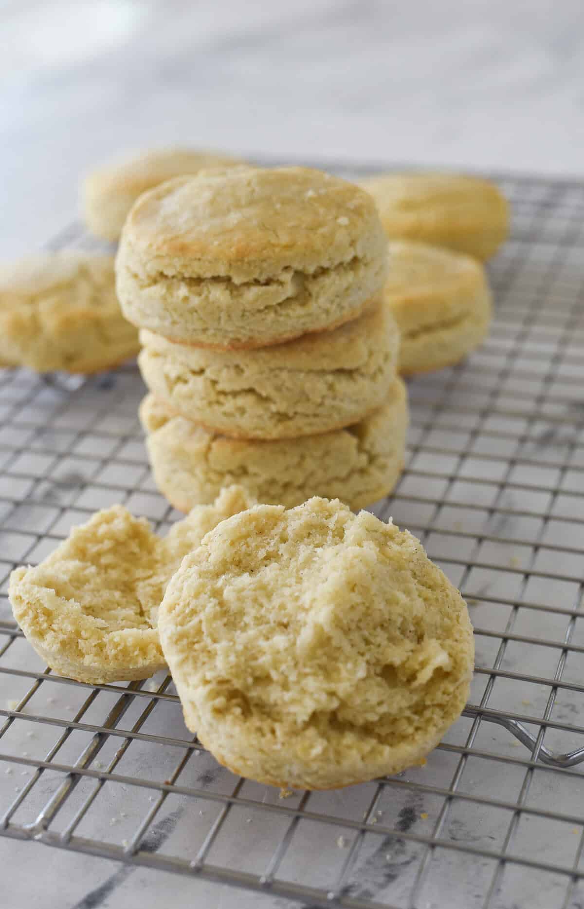 stack of biscuits with an open biscuit in front of it.