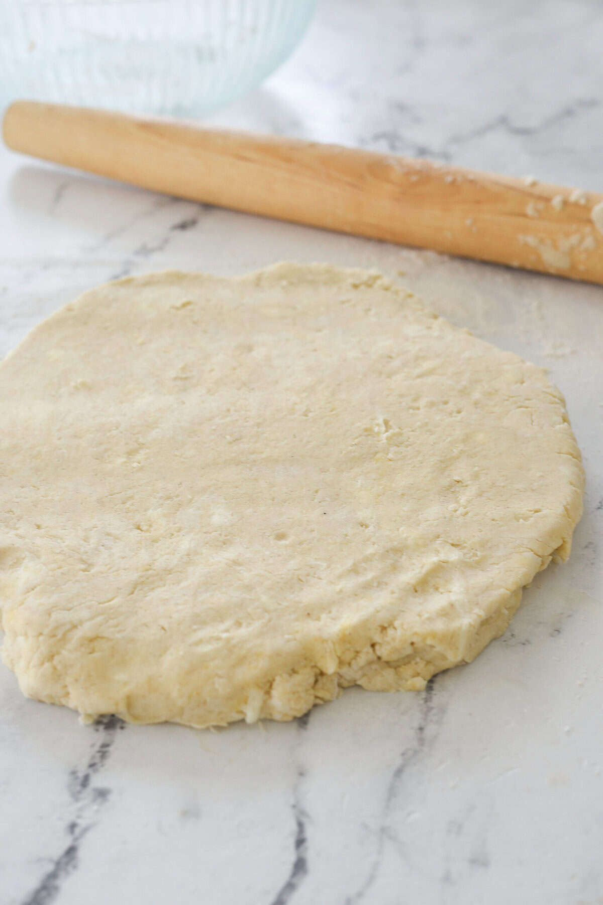 rolled out biscuit dough on counter