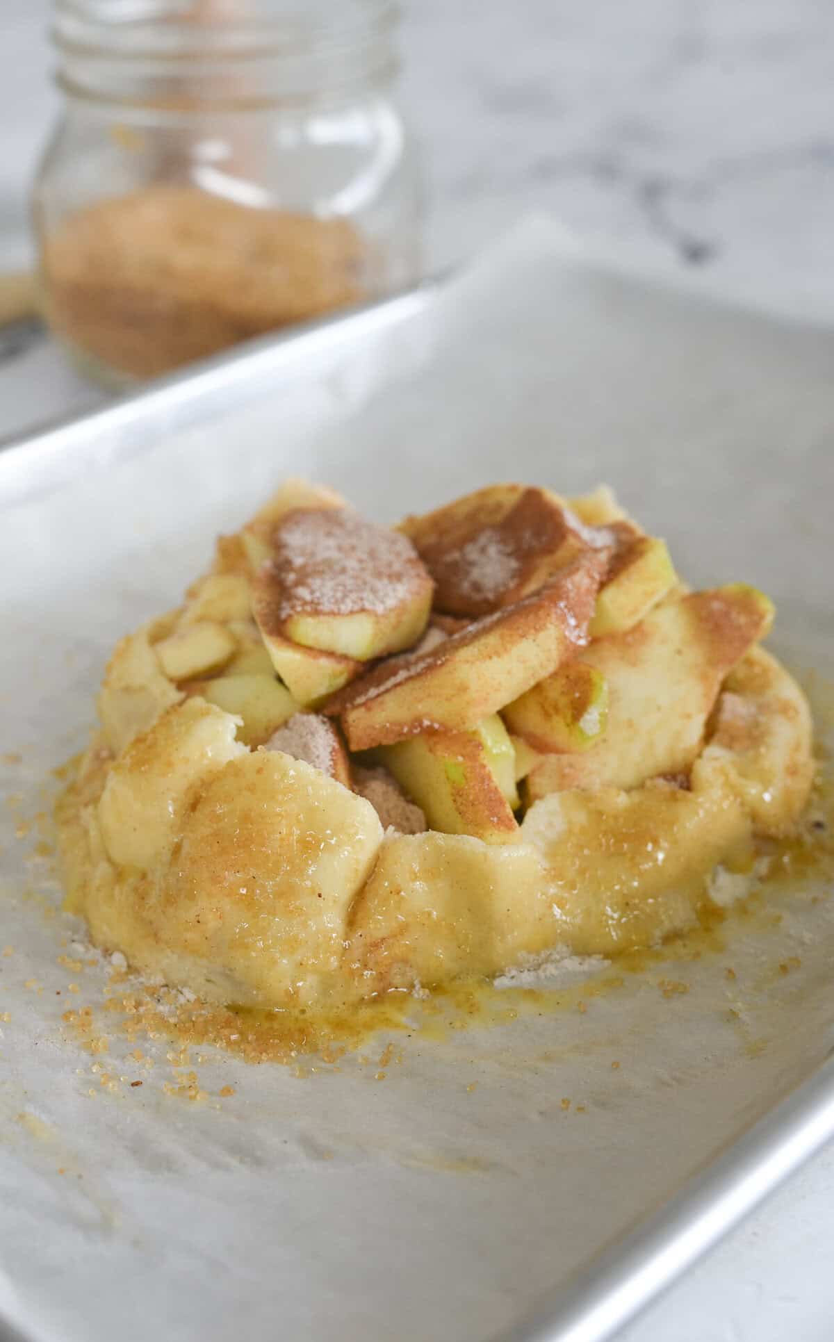 apple galette with egg wash and sprinkle of sugar on crust
