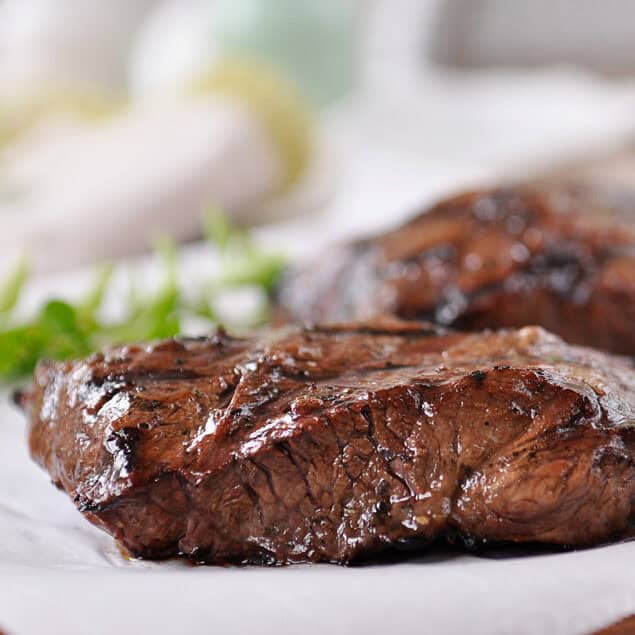 marinated flat iron steak on parchment paper